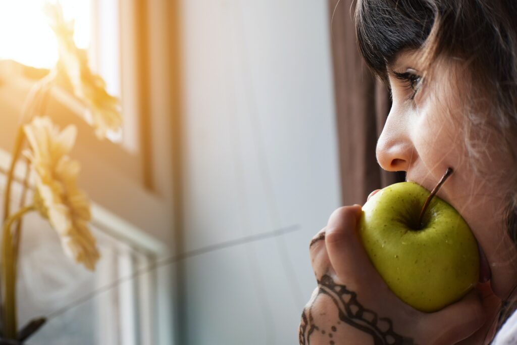 eating disorder, girl eating green apple